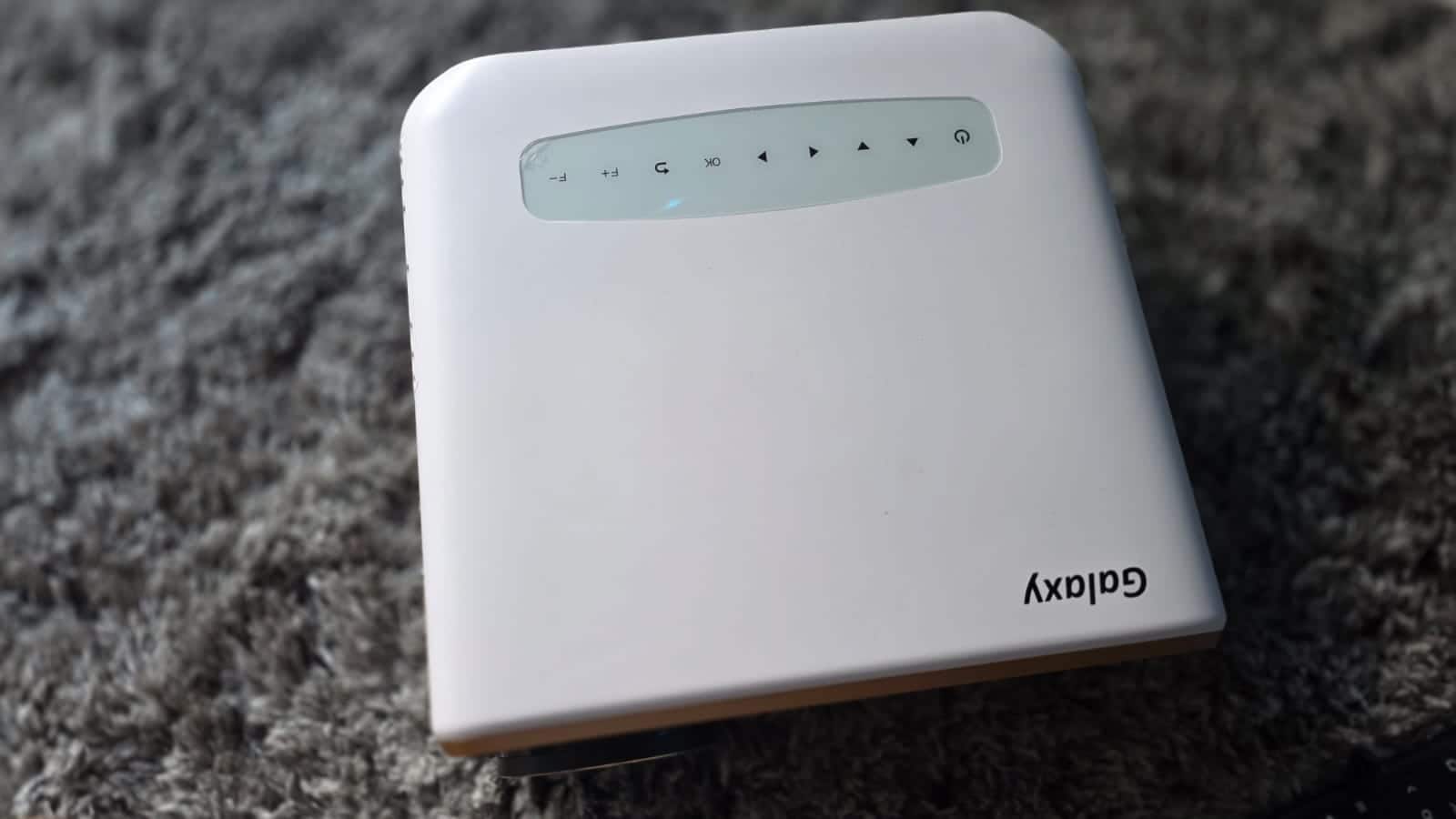 Verdict The OTEK Galaxy Smart Projector brings a long list of features at Rs 15,990, but the real-world experience is a mix of strengths and compromises. It does well in delivering a large-screen experience with decent 1080p quality at moderate projection sizes, stable Wi-Fi 6 connectivity, and useful auto-alignment tools that simplify setup. However, its performance falters when pushed — edges soften at larger screen sizes, brightness isn’t strong enough for daylight viewing, the bundled speakers don’t meet even casual expectations, and app limitations, particularly with Netflix and Prime Video, are hard to ignore. For first-time buyers who want an affordable entry into projection for movies, presentations, or occasional gaming, it makes sense if you pair it with an external speaker and keep the room conditions controlled. But if you are looking for a projector that can replace a television or provide a fully polished smart experience, you’ll need to spend more. The OTEK Galaxy Smart Projector is a decent choice, but only if you’re aware of its limitations.