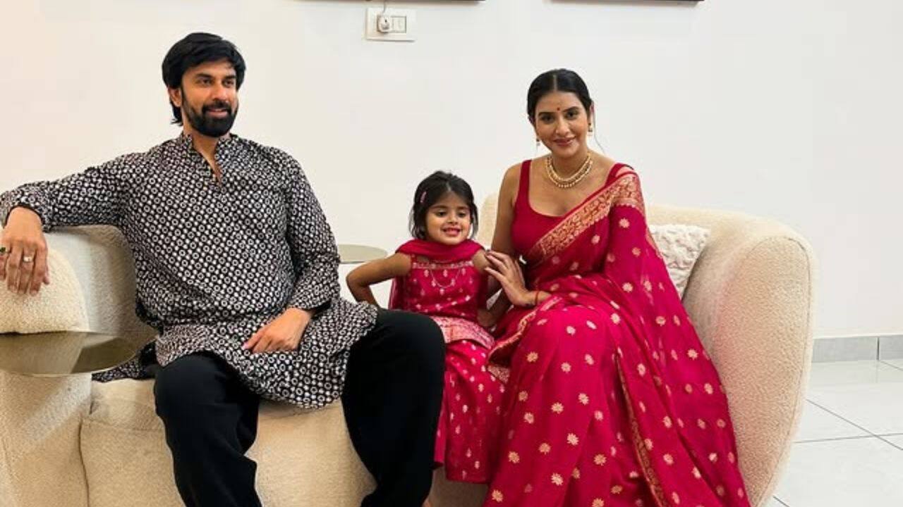 4. Rajeev and Asopa with Ziana One of the photos also highlights the close bond that the former couple share with their daughter Ziana as they posed together for a cozy family photo during the sixth day of Ganesh Puja celebrations. Charu looked stunning in a pink silk saree, while Rajeev wore a black kurta and Pajama set. Ziana was seen twinning with her mother in a pink lehenga choli. The trio were seen smiling in the pictures. 4. Rajeev and Asopa with Ziana One of the photos also highlights the close bond that the former couple share with their daughter Ziana as they posed together for a cozy family photo during the sixth day of Ganesh Puja celebrations. Charu looked stunning in a pink silk saree, while Rajeev wore a black kurta and Pajama set. Ziana was seen twinning with her mother in a pink lehenga choli. The trio were seen smiling in the pictures.
