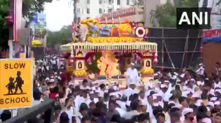 Crowds celebrating Ganeshotsav as noise levels in the city spike, raising health concerns.