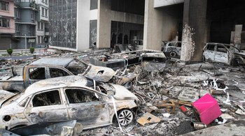 A general view shows charred vehicles amid the remains of the torched Ncell headquarter building, Nepal's leading mobile service provider, a day after it was set ablaze by protesters in Kathmandu on September 10, 2025. (Photo by PRABIN RANABHAT / AFP)