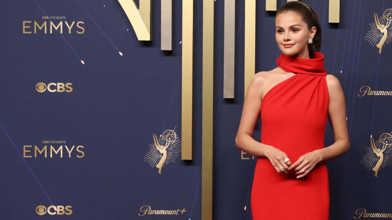Selena's fiancé, Benny Blanco, did a fashion-forward spin on formal wear in a black tailored suit. (Photo: Reuters)