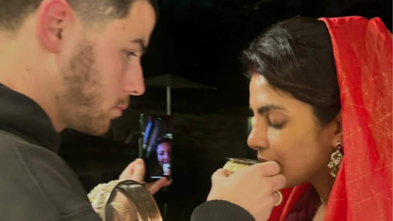 PriNick celebrates Karva Chauth  In this touching moment, Priyanka Chopra and Nick Jonas honor Karva Chauth. While Nick tenderly offers her water, Priyanka breaks her fast while wearing traditional clothing. A peaceful and significant celebration of togetherness is captured by the intimate ritual, which symbolizes love and devotion and masterfully combines cultural customs and their strong bond.