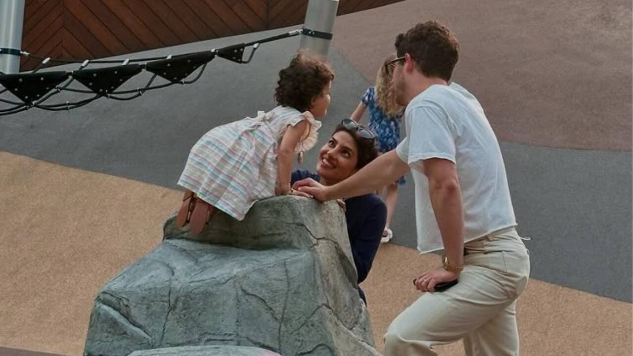 Daily Pleasures: An Outing with the Family  During a fun outing, Priyanka Chopra and Nick Jonas spend a loving moment with their daughter Malti. Nick holds them gently as Malti climbs a rock and Priyanka gazes up at her admiringly. The warmth and simplicity of regular family life are exquisitely captured in this unposed photo.