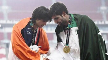 Neeraj Chopra and Arshad Nadeem shake hands after sharing the podium at the 2018 Asian Games