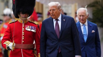 US President Donald Trump and Britain's King Charles III inspect a Guard of Honour during a Ceremonial Welcome in the Quadrangle at Windsor Castle, in Windsor, on September 17, 2025, during the US President's second State Visit. 