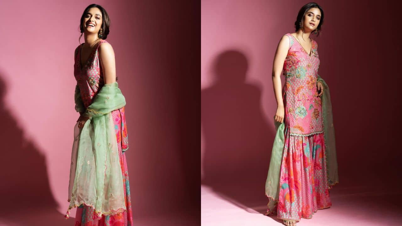 Keerthy’s pink ethnic bliss for Navratri. A pink printed gharara set with an elegant flared pants and a short kurti adds a touch of Keerthy's inspired charm to your Navratri outfit. Witha delicate green organza dupatta to create contrast, and style your hair in a chic braided ponytail.
