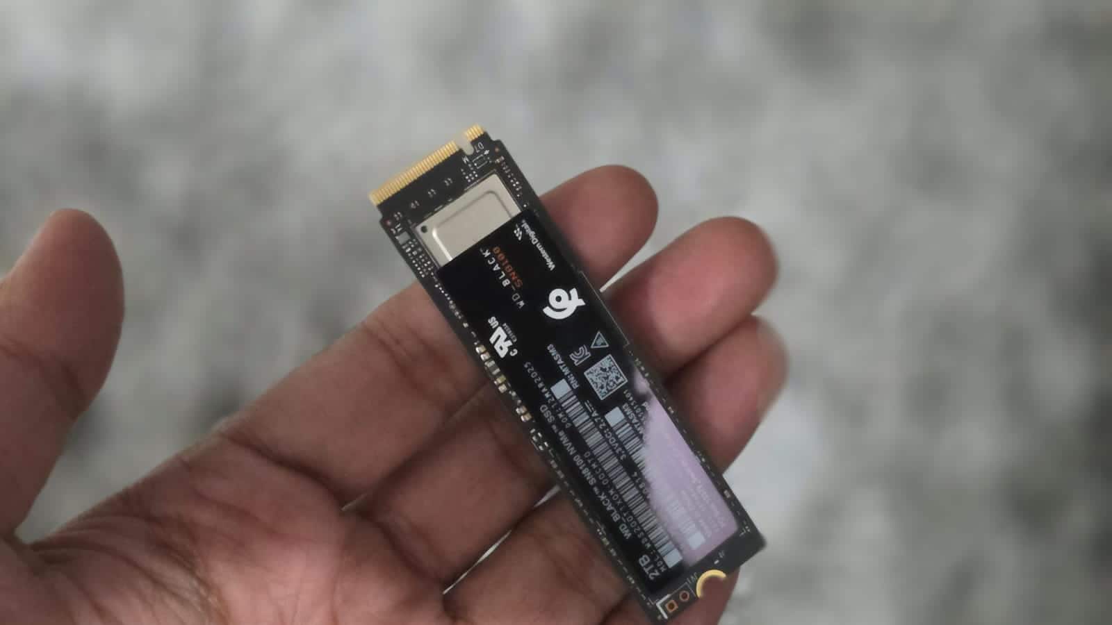  Design and storage options The SN8100 SSD offers capacities of 1 TB, 2 TB, and 4 TB. It's designed with both aesthetics and practicality in mind, suitable for compact builds and larger gaming desktops. Certain models include RGB lighting and a heatsink option with aluminium fins for thermal management. Under the hood, the drive utilizes an eight-channel controller with DRAM across all capacities, ensuring responsiveness even under heavy workloads. It also incorporates clock-gating technology, which reduces power consumption during lighter tasks, balancing performance with efficiency. This engineering acknowledges that Gen5 SSDs can quickly generate heat without active cooling.