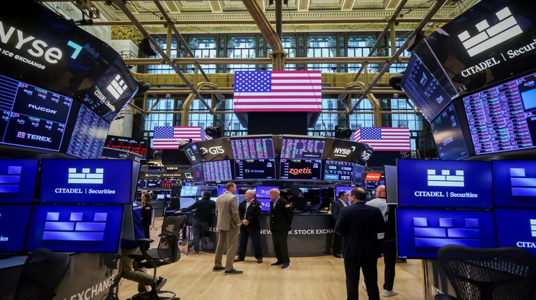 Traders work on the floor of the New York Stock Exchange.