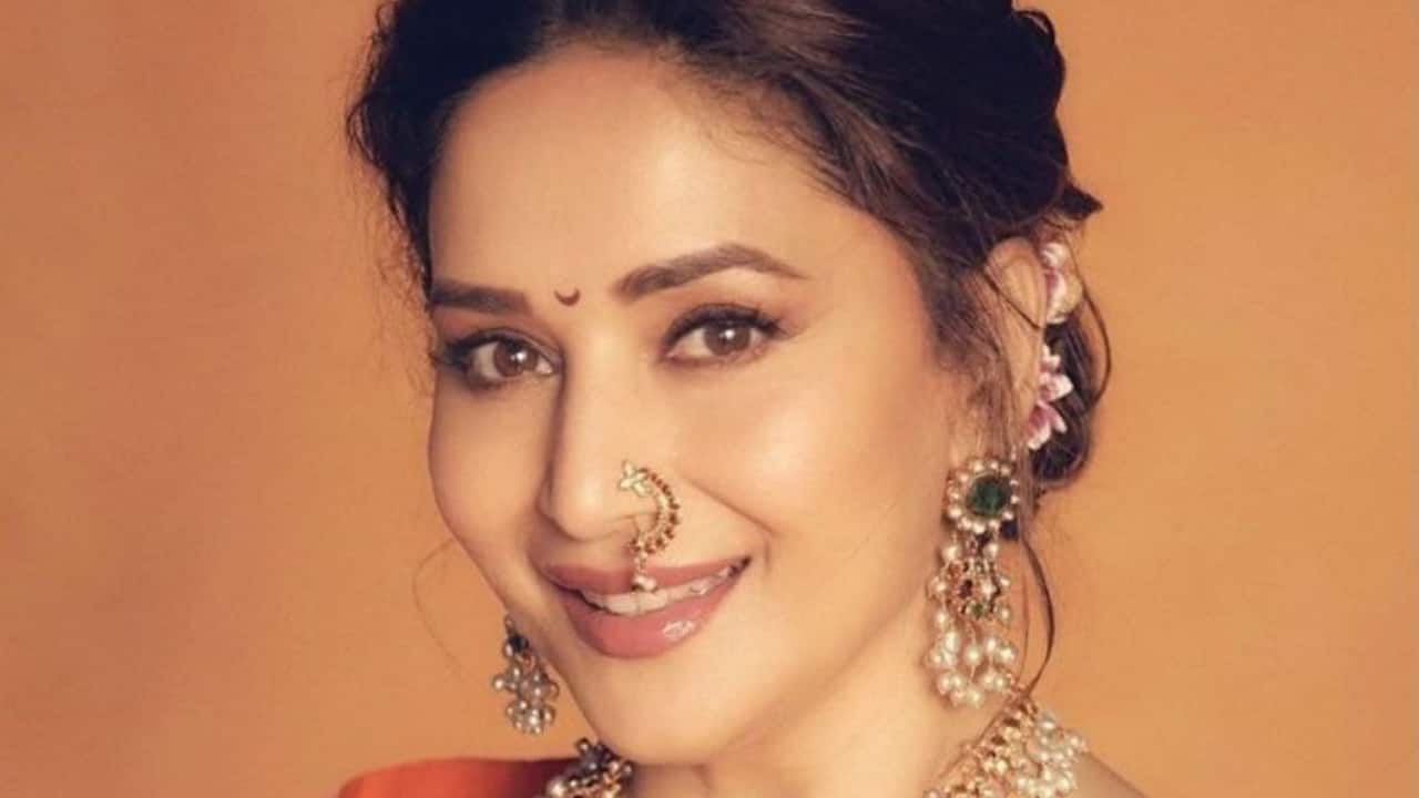 Gold and kundan jewelry perfectly complement the green sarees, elevating the festive vibe. The right accessories make her look complete without overwhelming the outfit.