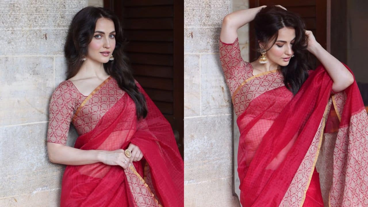Bold in borders Elli added another stunning red saree, but this time paired with a contrasting border, to add to the festive mood. She provided a playful vibe to the otherwise classic look by letting her long hair fall free. Bold in borders Elli added another stunning red saree, but this time paired with a contrasting border, to add to the festive mood. She provided a playful vibe to the otherwise classic look by letting her long hair fall free.
