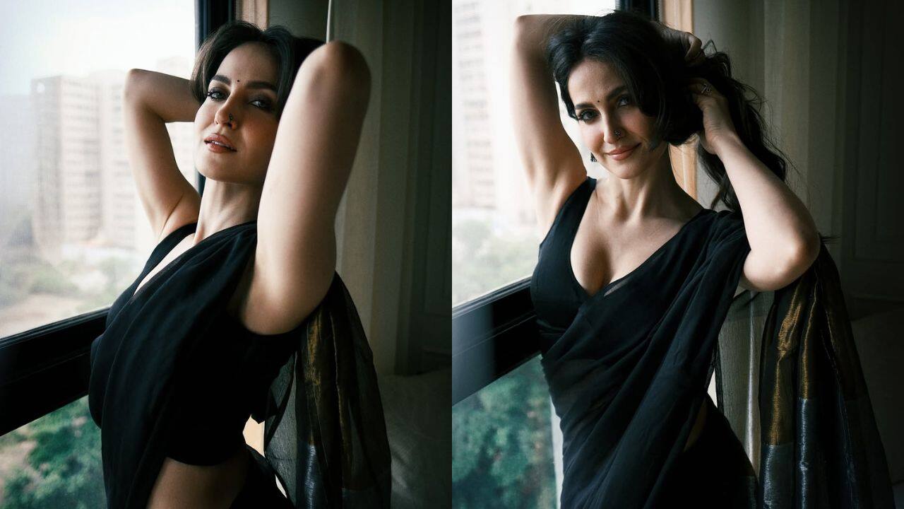 Timeless black A traditional black saree is a symbol of festive glamour. With her bold choice and the addition of a strappy blouse for a modern twist, Elli raises the standard higher. Black is the perfect festive color for this look, which is perfect for evening celebrations because it perfectly combines elegance and romance. Timeless black A traditional black saree is a symbol of festive glamour. With her bold choice and the addition of a strappy blouse for a modern twist, Elli raises the standard higher. Black is the perfect festive color for this look, which is perfect for evening celebrations because it perfectly combines elegance and romance.