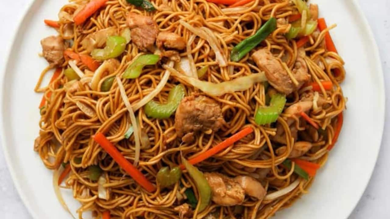 Kolkata street-style chowmein An Indo-Chinese fusion dish that is holiday food. Hot stir fried noodles mixed together with crunchy vegetables sauced in soy sauce, chili peppers, and even including chicken or egg, this is a quick serving, comforting and snack-like favorite among festival crowds. It's flavourful and has a bit of tang which makes the Chowmein a great bite to eat for any one during Puja Celebrations.(Image: Pinterest)