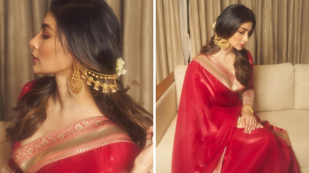 Glamorous Earring Chain Mouni Roy’s look is a festive delight, especially her beautifully designed earrings with a hair chain. Her Bengali red saree truly shines with the jewels, which also include a set of gold bangles. It seems it’s time to bring out everything gold.(Image: Instagram)