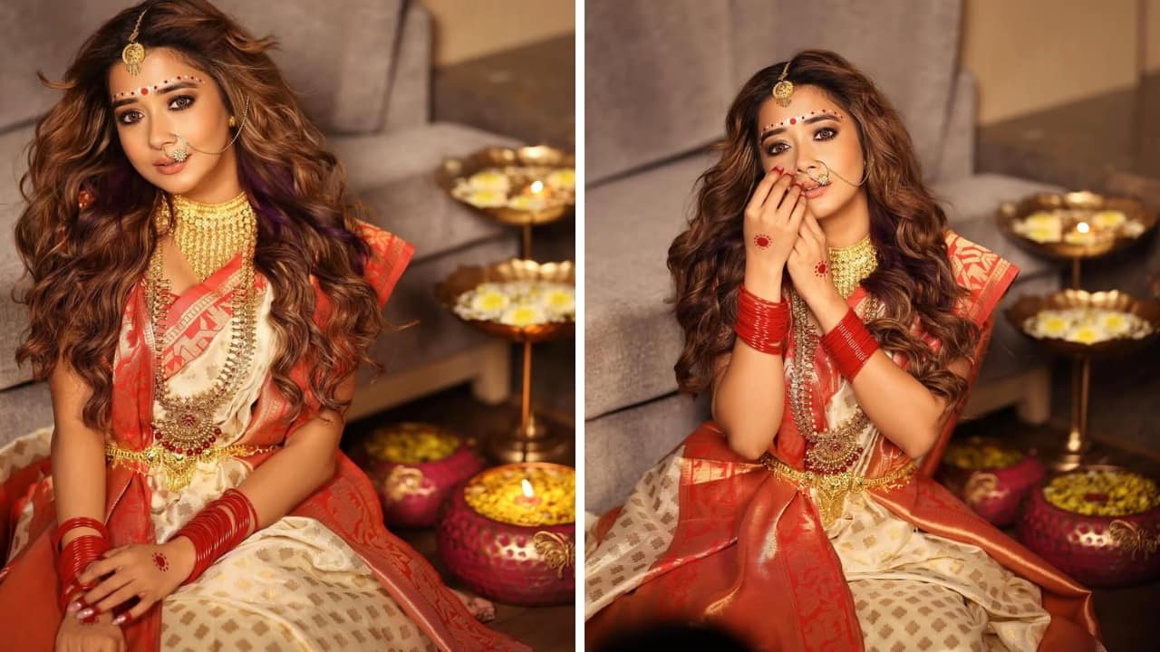Mix and Match Just like Mimi, Tina Datta’s look is all about gold glam with a red twist—typical Bengali and utterly feminine. The actress’s gold maang-tikka and nath add extra festive charm, while the red bangles enhance the traditional look, complemented by alta and forehead bridal bindis.(Image: Instagram)