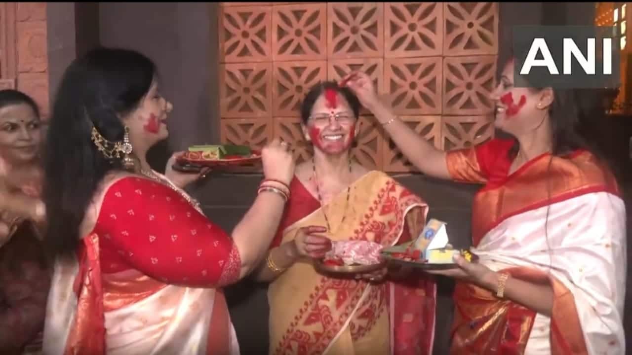 Participating in Sindur Khela is believed to protect women from widowhood, strengthen their family roles, and promote harmony in the community. 6. The ceremony has steps: worshipping the goddess, touching her face with betel leaves, smearing sindoor, and exchanging sweets among participants. 7. Beyond religious significance, Sindur Khela fosters bonding among women, symbolizing both a playful farewell to the goddess and the collective strength and unity of women. 8. (Photo: X)