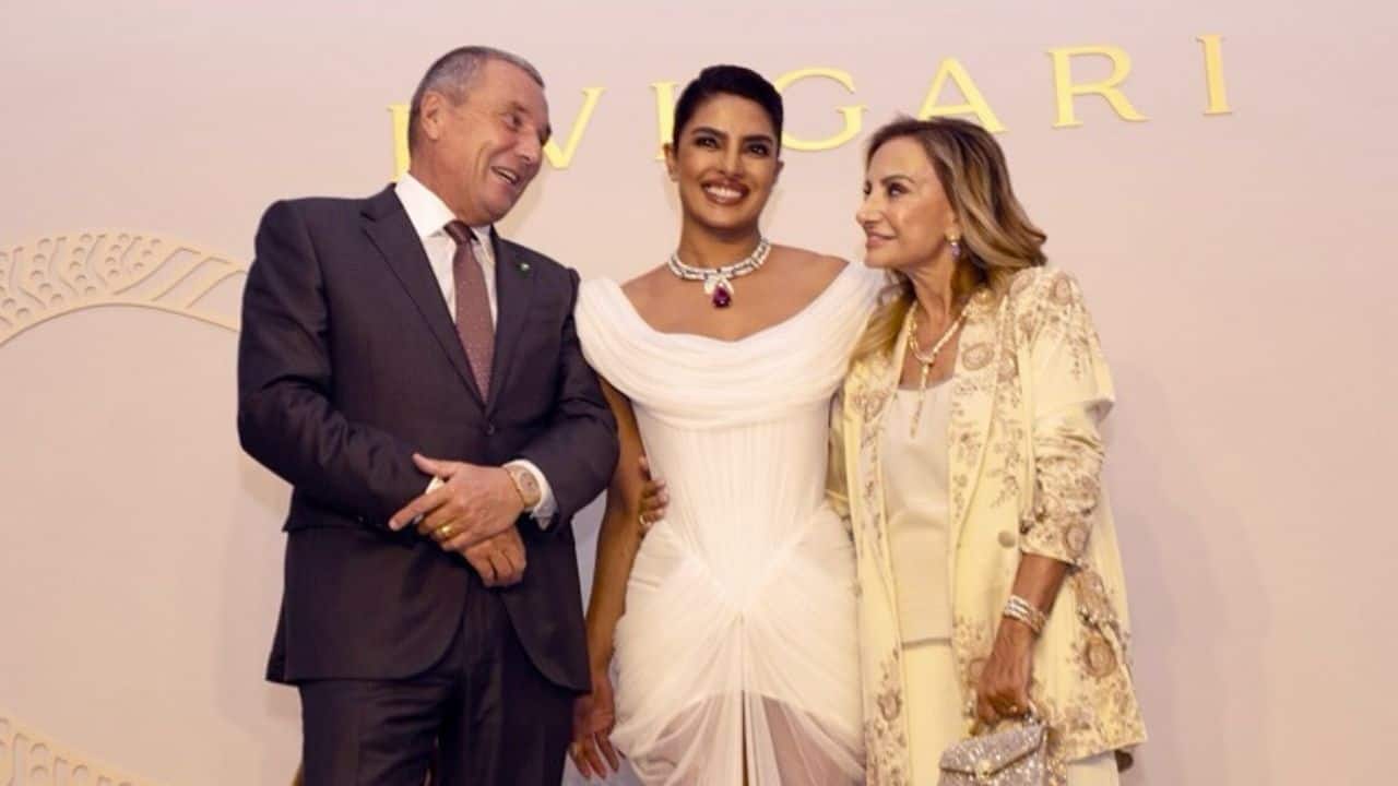 Posing with the CEO Priyanka Chopra, in her striking white gown and magnificent Bvlgari necklace posed with Bvlgari's Group CEO, Jean-Christophe Babin. The three of the them in the image were seen sharing a friendly moment in the event's stylish, well-lit setting, highlighting Priyanka's role as a global brand ambassador and mentor.
