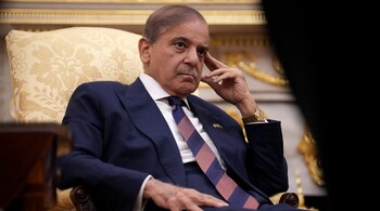 Prime Minister of Pakistan Shehbaz Sharif looks on as US President Donald Trump speaks to reporters in the Oval Office of the White House on September 25, 2025 in Washington, DC. 