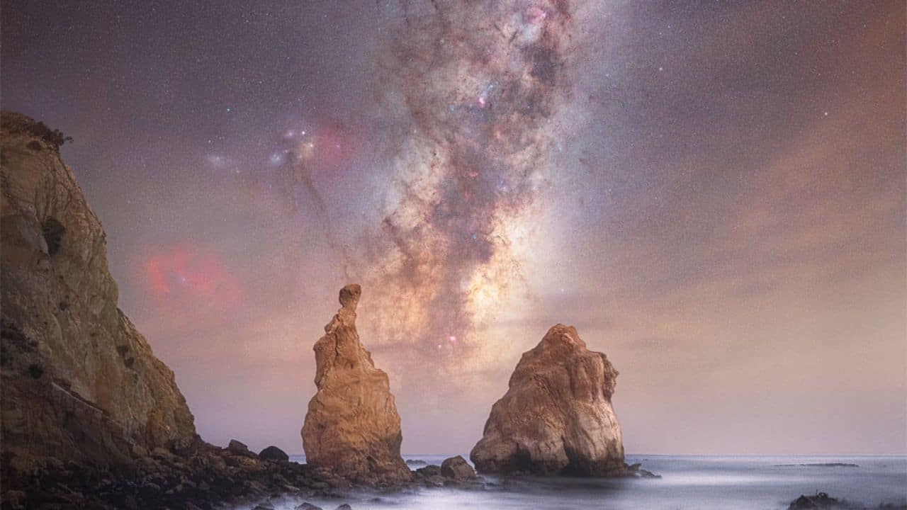 Milky Way Through Otago Spires: The Milky Way’s bright core perfectly frames between Otago’s rock spires, a rare sight requiring precise timing and location as Earth’s orbit shifts our galactic view. (Image: NASA)