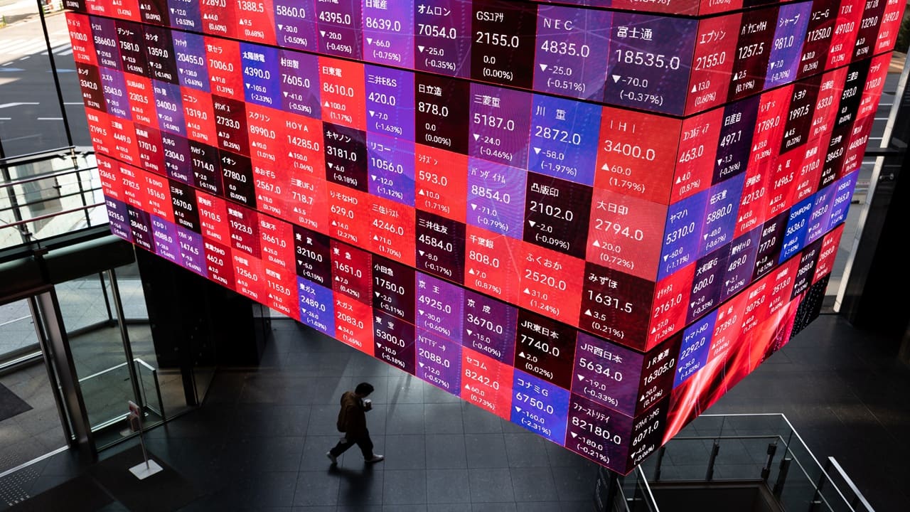 Asian shares jump to record on Japan, gold rallies