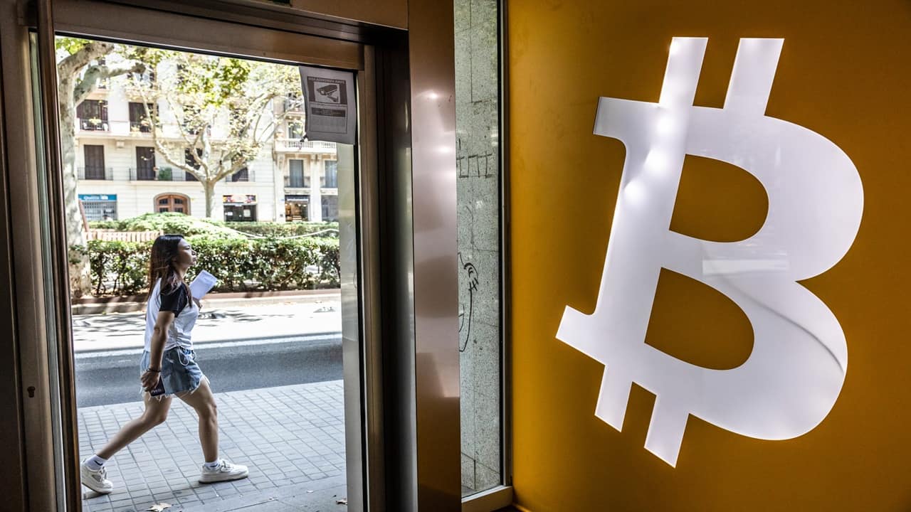 Bitcoin hovers near record after topping $125,000 on Sunday