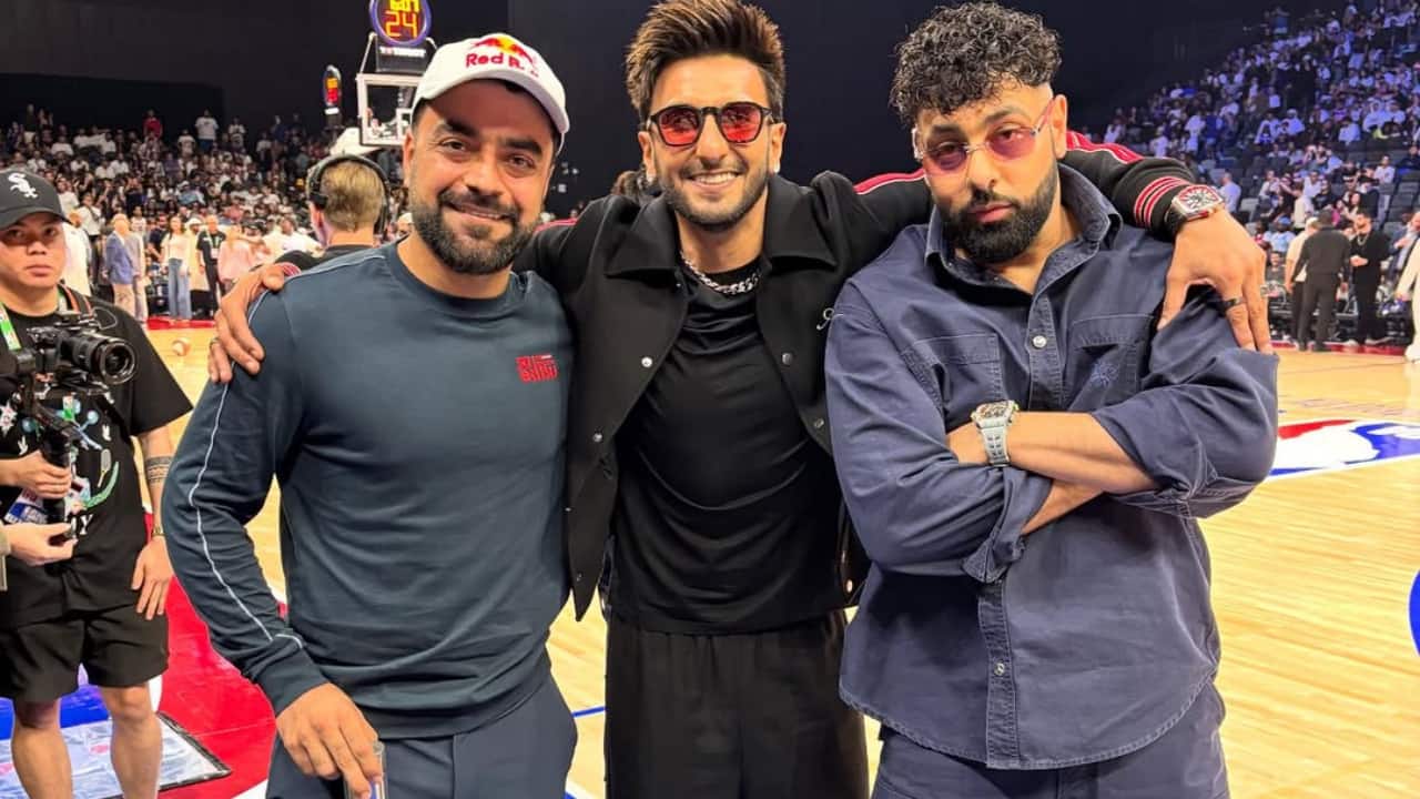 Afghanistan cricketer Rashid Khan poses with Ranveer Singh and rapper Badshah at NBA Abu Dhabi Games 2025