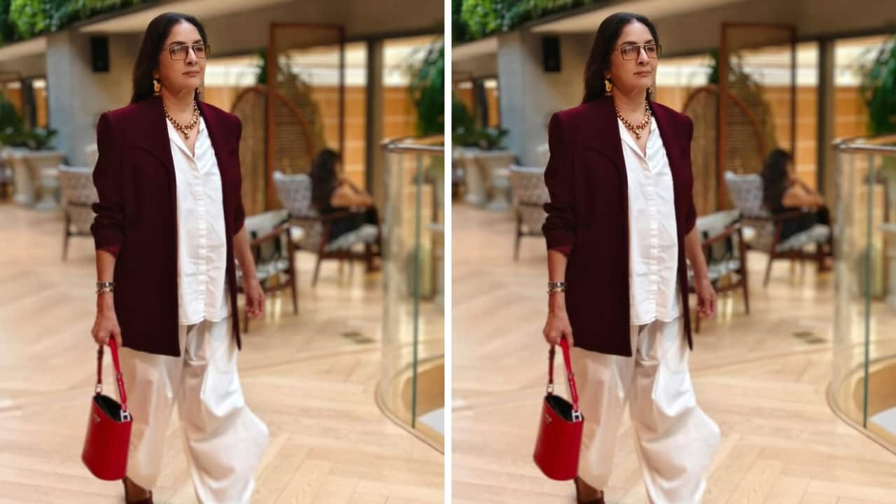 Fashion-forward glam Neena Gupta’s dress is quite fashion-forward with all its detailing. While the white shirt and harem-style trousers look nouveau, her layering with an open burgundy jacket is smart. Her gold and ruby jewellery make the look glamorous.(Image: Instagram)