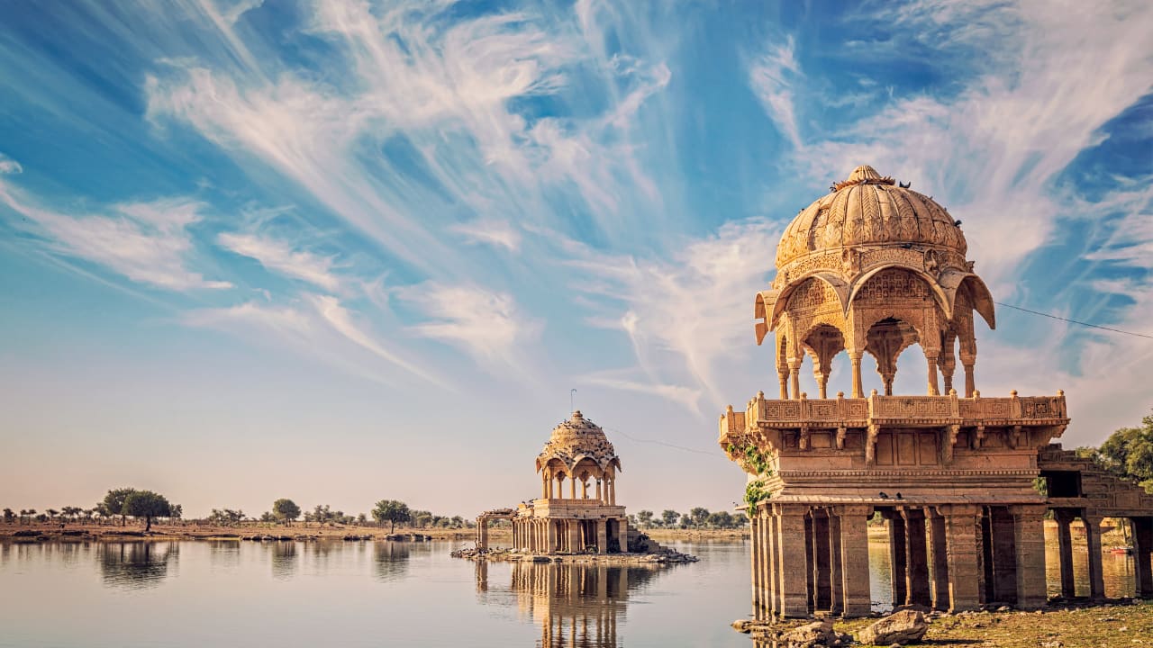 JAISALMER – DESERT ROMANCE Jaisalmer’s golden desert landscape offers couples a unique romantic experience under the stars. Take a camel safari across the Thar Desert at sunset, watch the dunes change color with the fading sun, and capture beautiful photographs. Spend the night in luxury desert camps, enjoying bonfires, folk music, and traditional cuisine. Explore the city’s historic fort, bustling bazaars, and intricately carved havelis during the day. Jaisalmer provides a magical combination of adventure, culture, and intimacy, making it a perfect destination for couples celebrating Karwa Chauth and looking to make memories that last a lifetime.