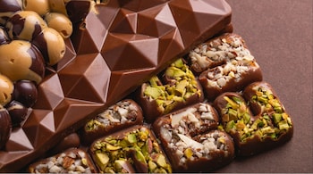 Part of Dubai chocolate's appeal, though, is the way it feels simultaneously indulgent and worldly. Pistachios, rose, saffron and cardamom bring luxury, travel and exoticism to the chocolate party. (Representational image: Unsplash)