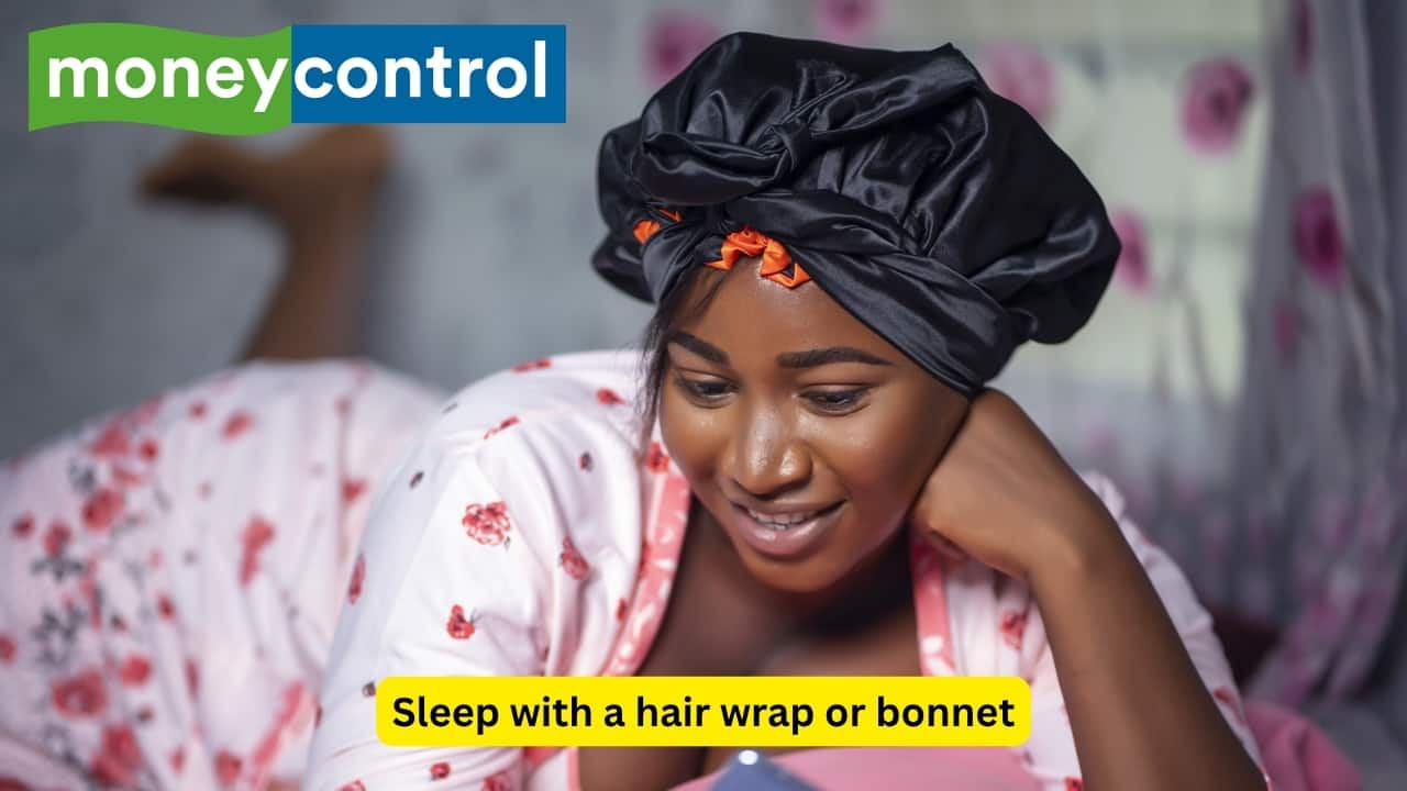 Sleep with a hair wrap or bonnet Wearing a silk or satin wrap will protect your hair from breakage and allow you to extend the life of your hairstyle. This is especially beneficial for those with curly or textured hair that is prone to dryness. These additional protective measures help to lock in moisture and fight frizz while you rest. (Image: Canva)