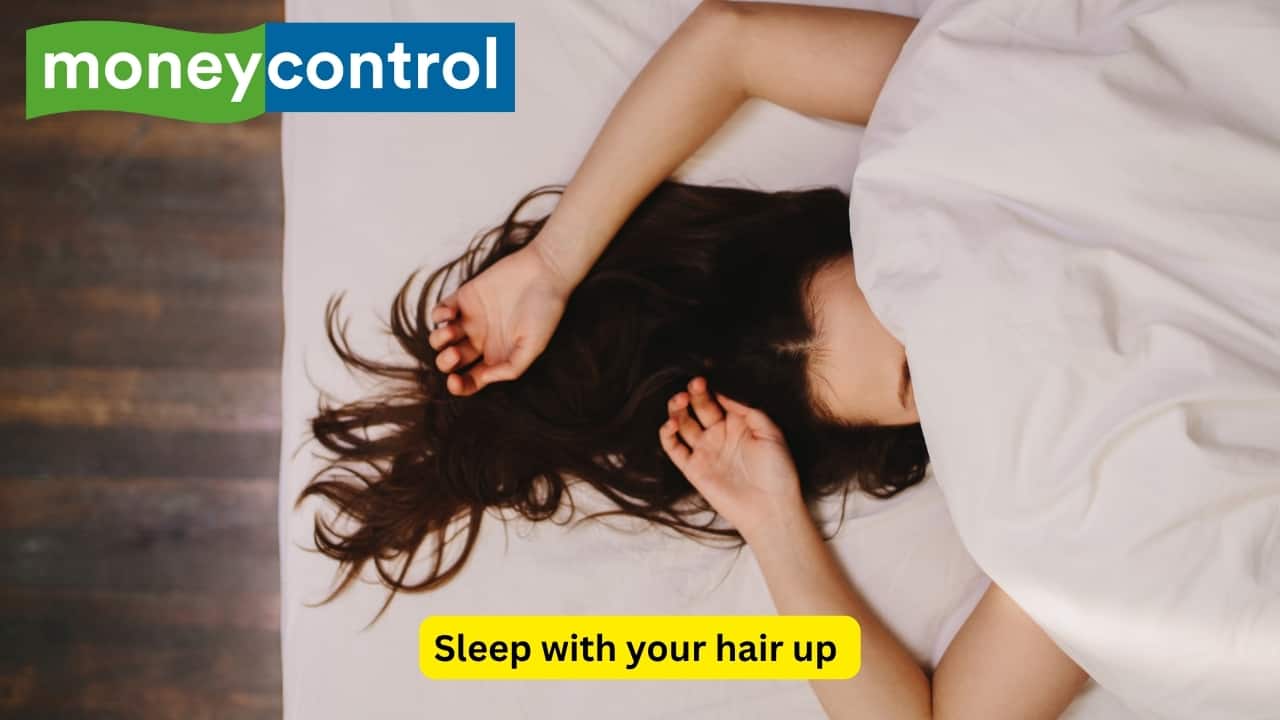 Sleep with your hair up Keeping your hair up at night helps stop it from sticking to your neck and getting sweaty. Just make sure the style is loose, so it doesn’t pull or cause tangles. This helps your hair stay cleaner, smoother, and less likely to break while you sleep. (Image: Canva)