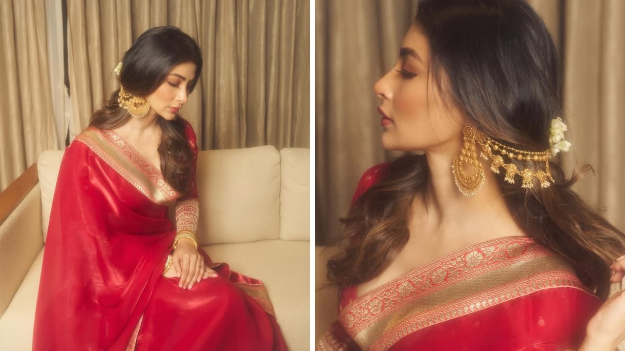 Mouni Roy Mouni Roy looks delightful in a luxe red saree adorned with a traditional gold border. The one piece of jewellery that steals the spotlight in this look is the dazzling gold ear chain with three decorative strings, making it quite a cherished piece. (Image: Instagram)