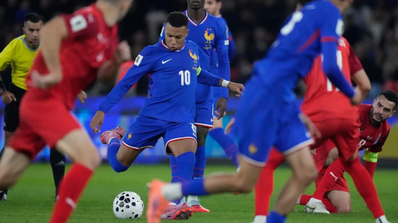 Kylian Mbappé scores but limps off late in France's World Cup qualifying win. Germany gets boost