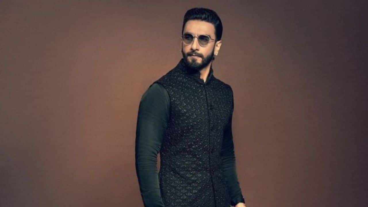 Modern Midnight Majesty In this all-black outfit, Ranveer Singh opts for a stylish and minimalist style. For a modern take on tradition, the actor wears a textured, lined bandhgala jacket with a solid black kurta. His effortlessly stylish Diwali outfit was completed with a sleek hairstyle and round, tinted glasses.