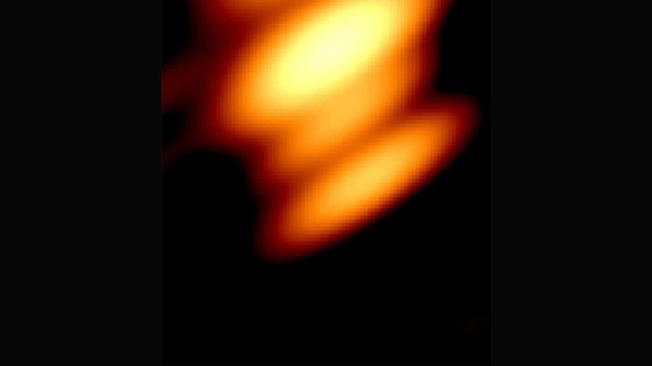 Unbelievable Discovery: Two Black Holes Dancing in Cosmic Harmony!