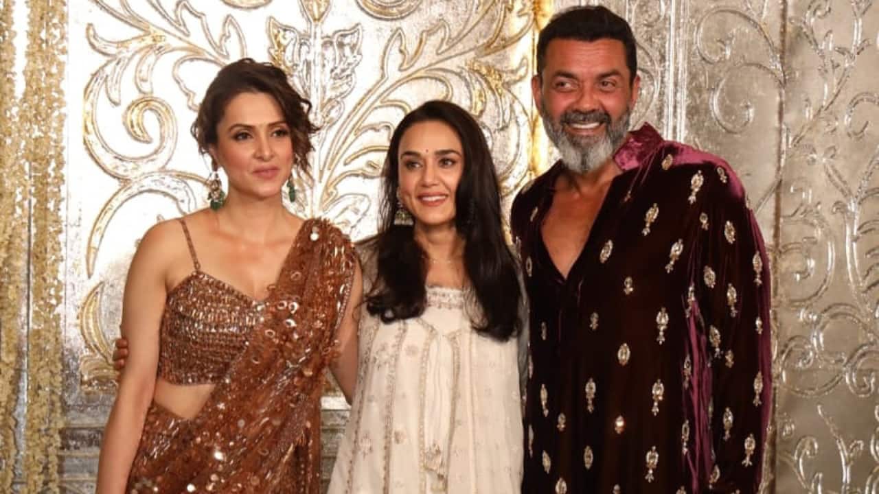 Bobby Deol and Preity Zinta Bobby Deol sported a deep maroon velvet-look kurta with subtle embroidery. He posed with his wife, Tanya Deol, who sported a bronze-brown sequined saree with a matching sweetheart-neck. Bobby had a reunion with Border co-star Preity Zinta as the actress joined the couple for the pics. Preity sported an elegant white Anarkali adorned with subtle silver or gold embroidery patterns.