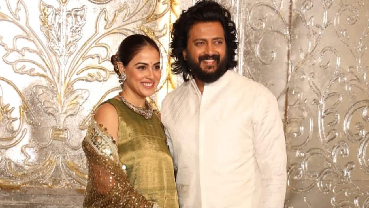 Genelia D'Souza and Riteish Deshmukh The most beloved couple of B-town made a stunning appearance at the Diwali party. The couple smiled for the paps and posed for the cameras. For the event, Genelia sported an olive or moss-green sleeveless. Riteish complimented Genelia in a traditional white Indian outfit.