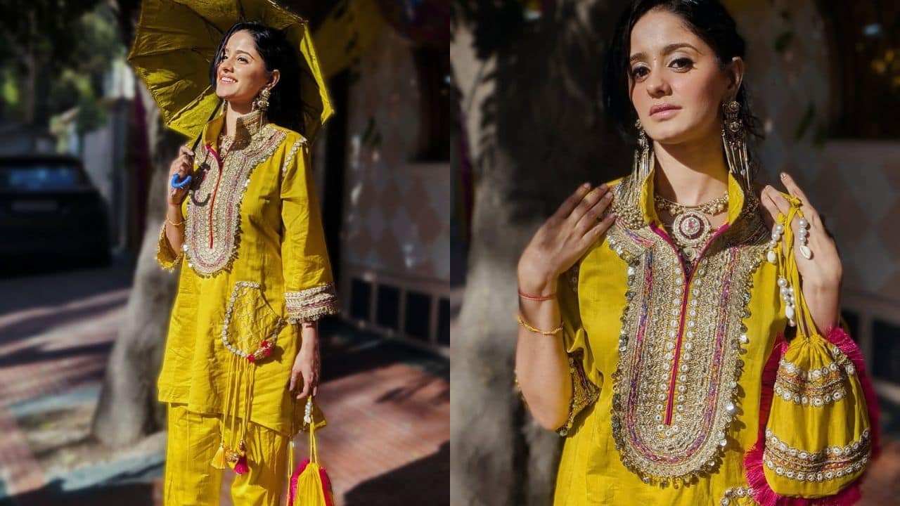 Ayesha Singh Ayesha has her outfit laced with a heavy neckline work on her mustard salwar suit. With rustic chandelier earrings and a jhola with the same combination wear. She gives us oodles of festive vibes. 