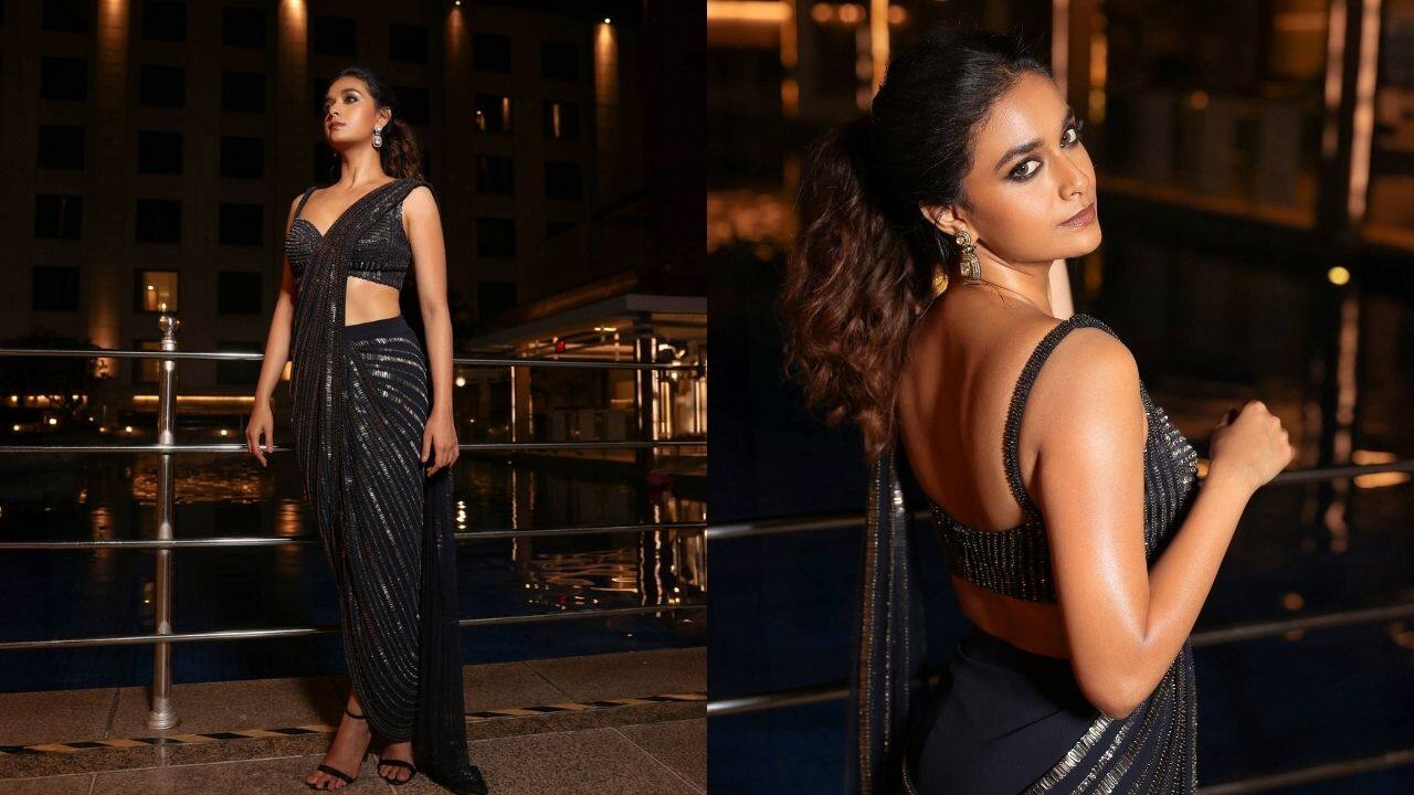Where Tradition Meets Trend Choose this metallic black saree with sequins all over it to perfectly accent the toned figure and combine the essence of the traditional saree with a modern twist. It exudes festive glam when paired with a ponytail, a sweetheart-neck blouse, and striking silver earrings.