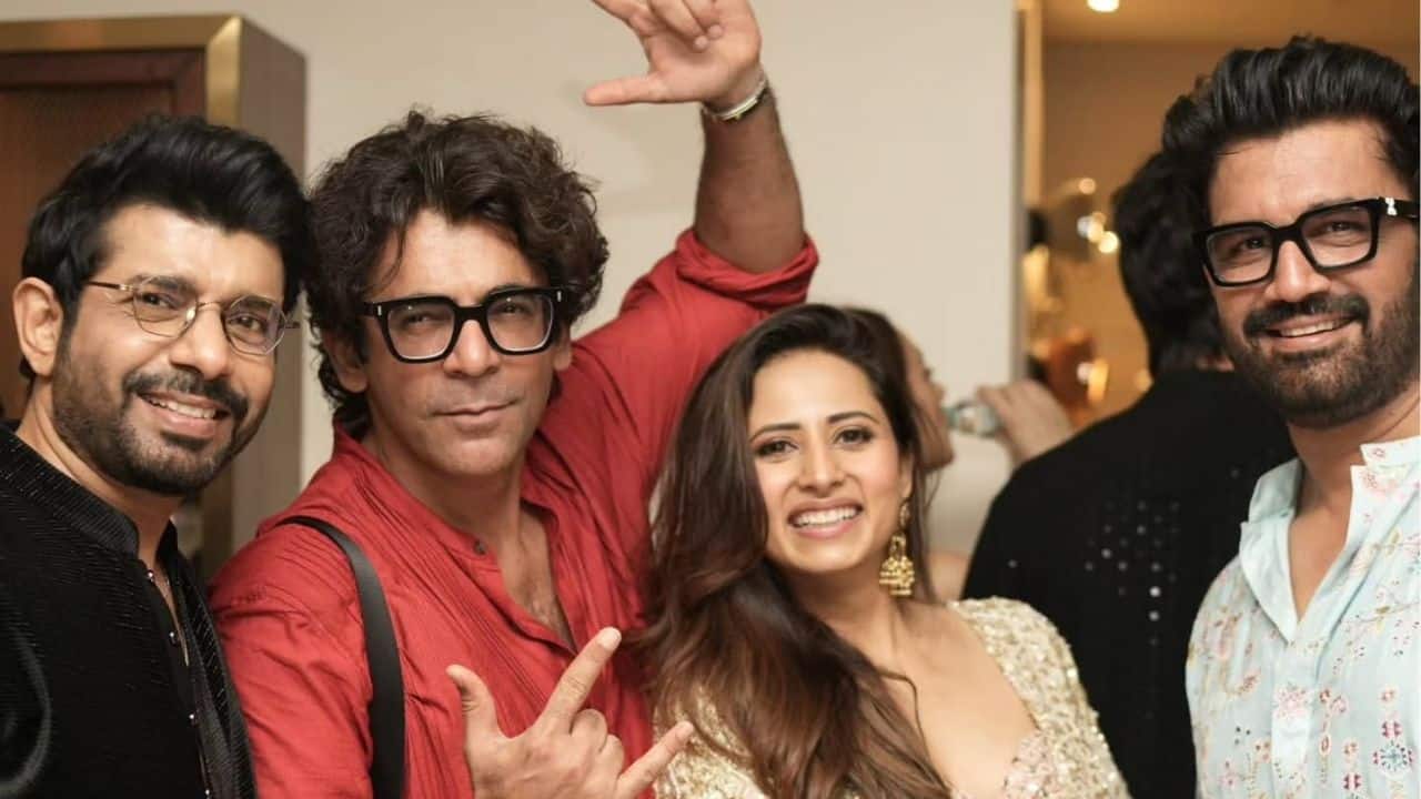 Sargun Mehta was seen sharing a fun and lively moment with **Sunil Grover** and other guests during the Diwali celebration. Dressed in a dazzling golden outfit, Sargun glowed with her radiant smile as Sunil, in a bright red kurta, struck a playful pose for the camera. The group’s cheerful energy and camaraderie perfectly captured the joy and festive spirit of the evening, making it one of the most heartwarming highlights of the celebration.