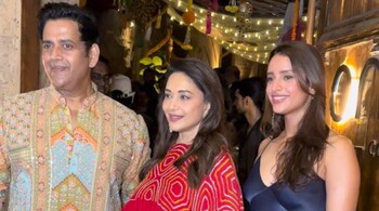 Triptii wore a dark blue dress to keep her look stylish and understated, while Madhuri looked stunning in a white suit and a bright red dupatta for the occasion.