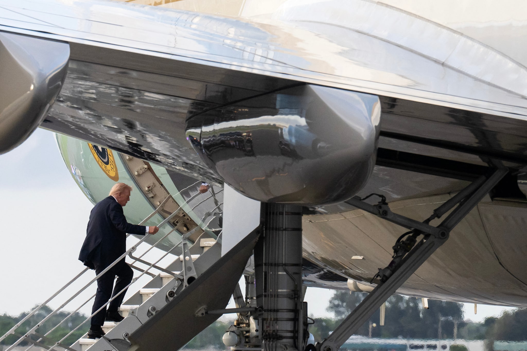 Another security breach? Trump uses smaller staircase to board Air Force One after sniper’s nest discovered near Airport