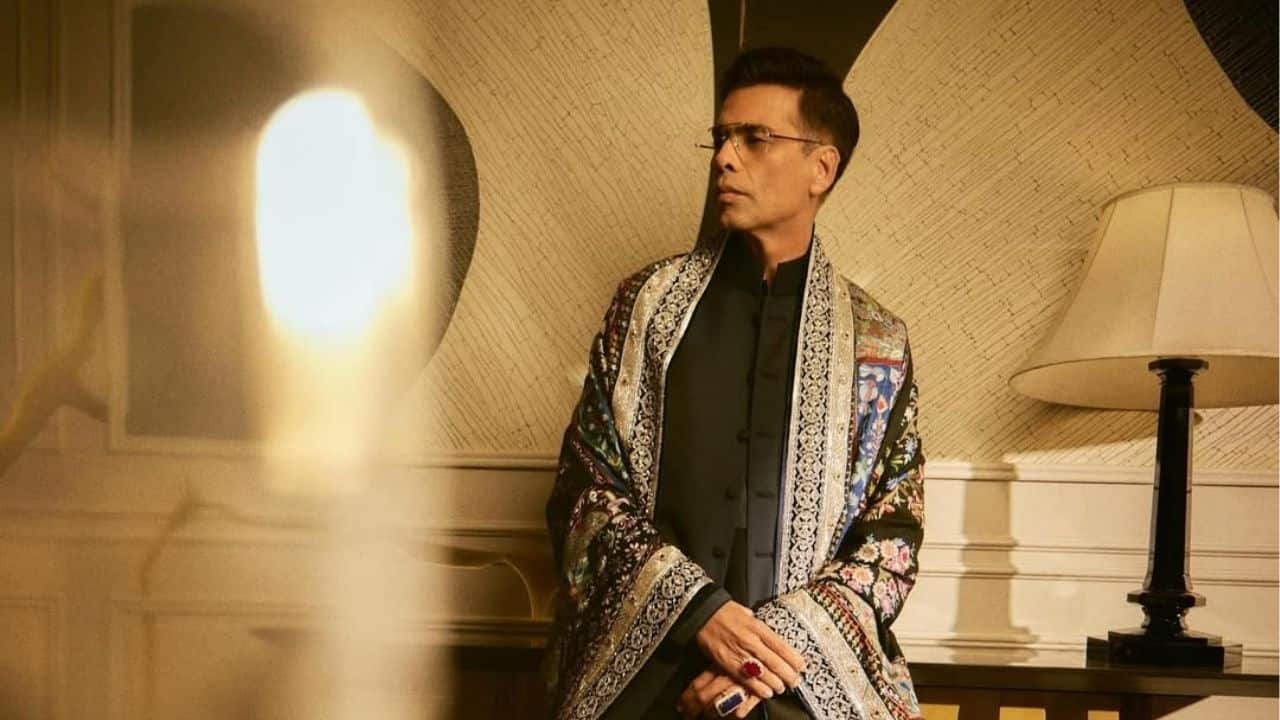 Prior to the lavish celebration he threw at his house, Karan Johar striks a chic pose in his exquisite Diwali attire. He shows off style and sophistication while wearing a black kurta set and a richly embroidered shawl with floral patterns.