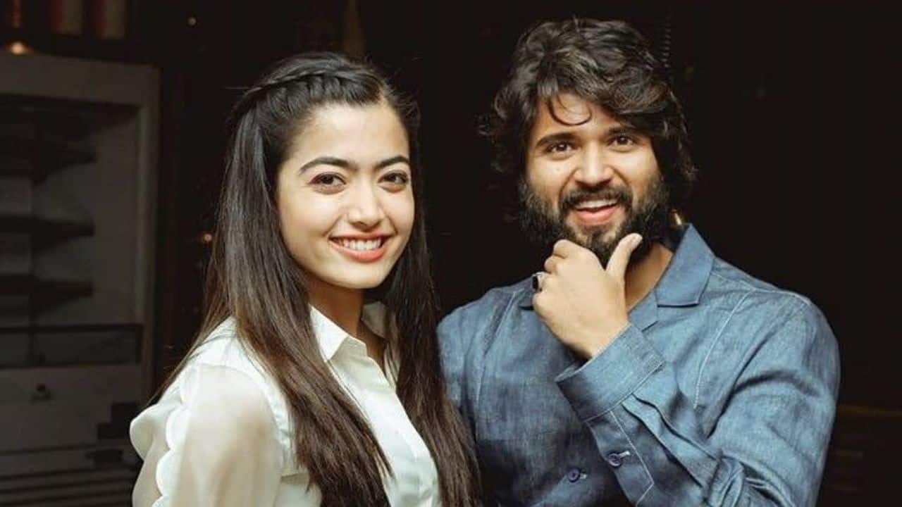 Candid Chemistry The cute pair's similar yet contrasting styles display genuine charm. Vijay's keen gaze and playful pose, along with Rashmika's radiant smile and sophisticated hairstyle, perfectly show the easy and beloved chemistry that makes them one of the most charming duos.