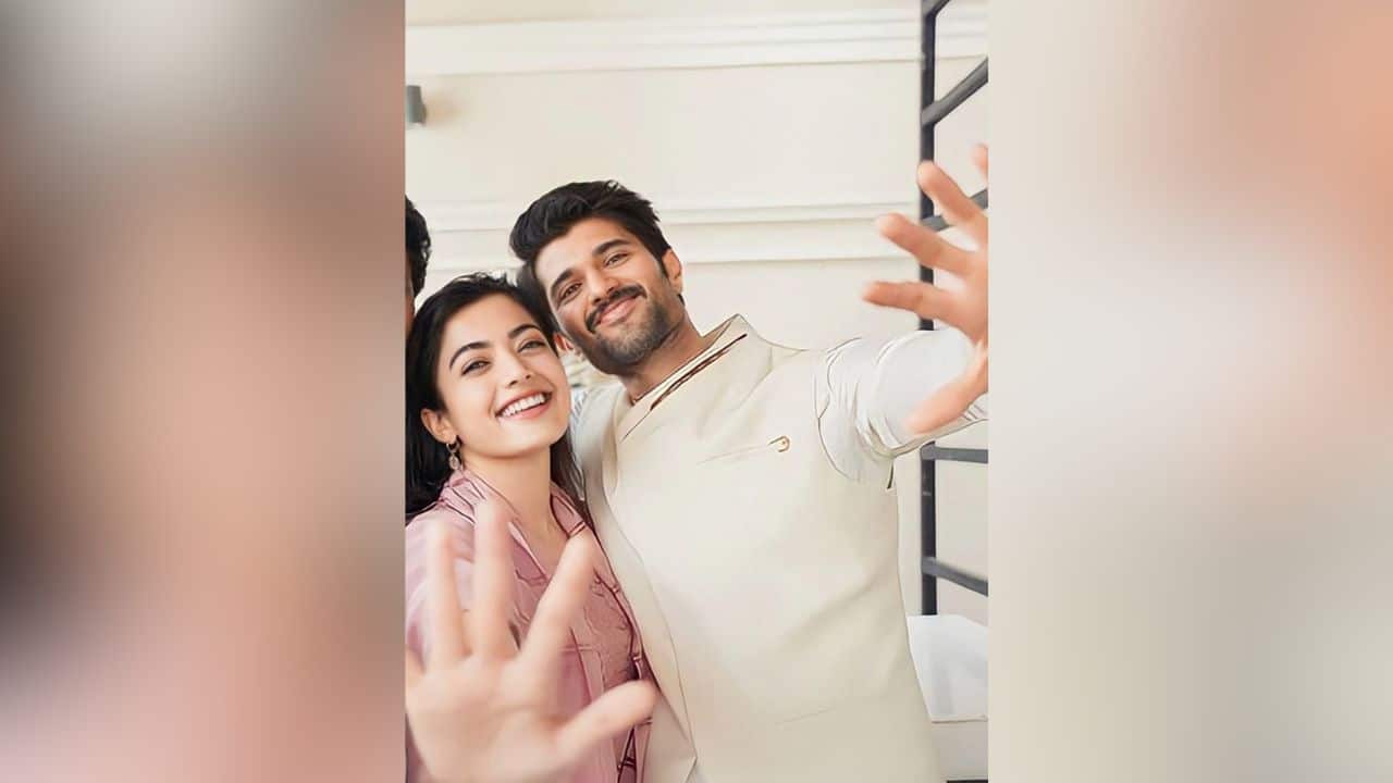 Sweet Duo Goals Rashmika Mandanna and Vijay Deverakonda smile pleasantly in this adorable picture. Their obvious and charming off-screen chemistry can be seen by their carefree, happy energy and playful pose, in which both of them are reaching out to the camera.