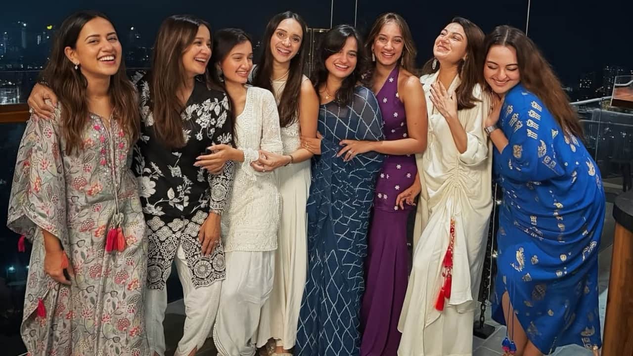 6. Sonakshi glows in blue as she joins her girlfriends for a balcony picture filled with laughter and style. The night sky, bright lights, and camaraderie make this frame a perfect snapshot of festive joy.