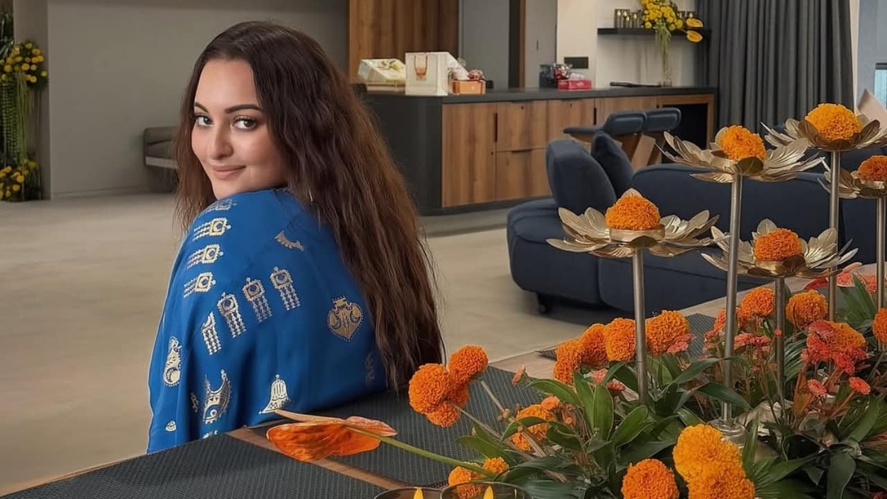 9. A candid shot of Sonakshi and Zaheer sharing laughter amid marigolds and candles. The joy in their eyes says it all—love, comfort, and the beauty of celebrating life’s small moments together.
