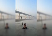 Video | Delhi BJP MLA slips into Yamuna as AAP-BJP lock horns over pollution amid Chhath