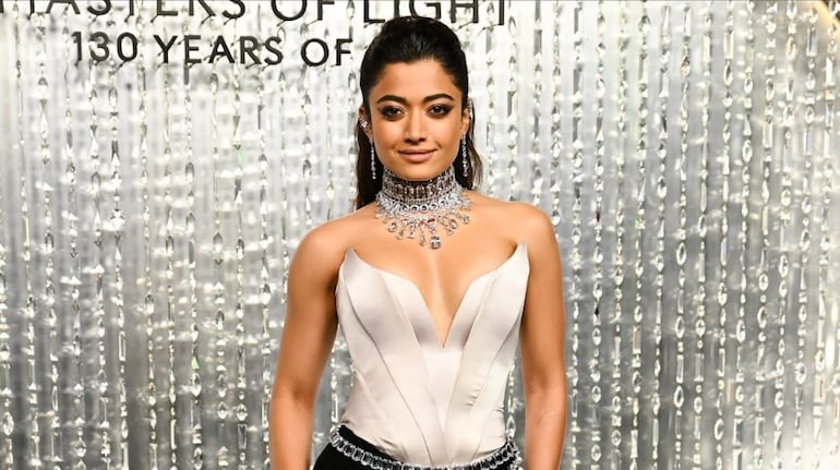 Rashmika Mandanna shines at Swarovski’s 130-year ‘Masters of Light’ exhibit in Los Angeles, wearing a metallic corset, crystal belt, and luxe jewellery.