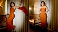 <strong>Fusion Fun</strong><br />Mrunal looks charming in a rust corset paired with a knotted, draped skirt, which fits her beautifully. The contemporary fusion look is given a desi touch with a sleek stole and accessorised with chic gold earrings.