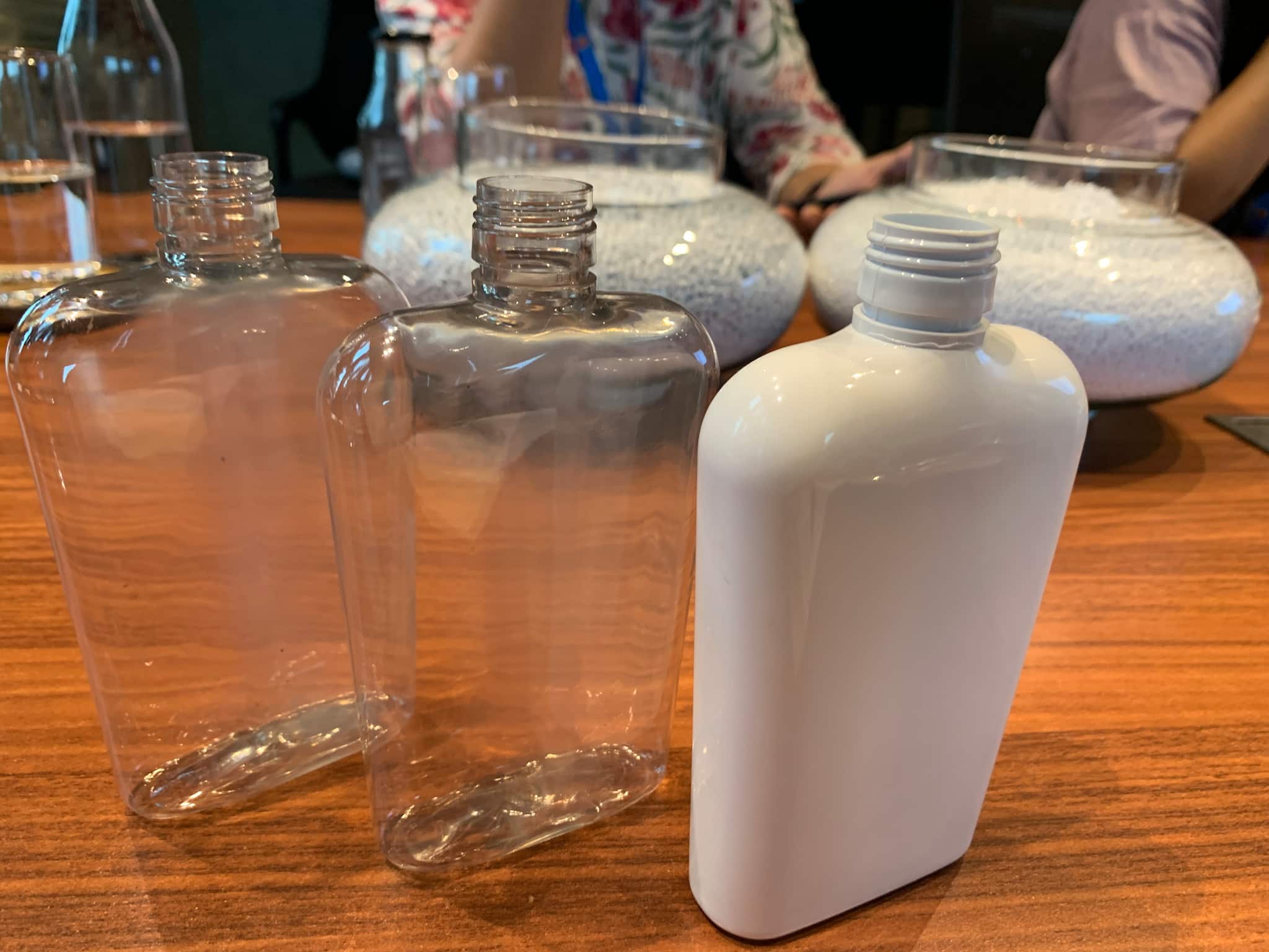 Pahwa or 180 ml bottles made with (from left) virgin PET, recycled PET, and rPET with white colouring. At GGVL's distillery and ENA plant near Indore. (Image: Moneycontrol)